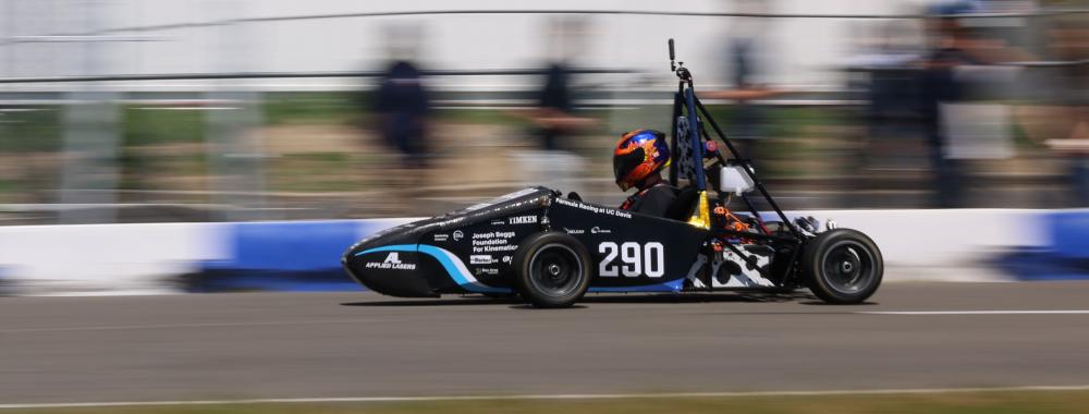 FE11 driving on track, blurred background from speed