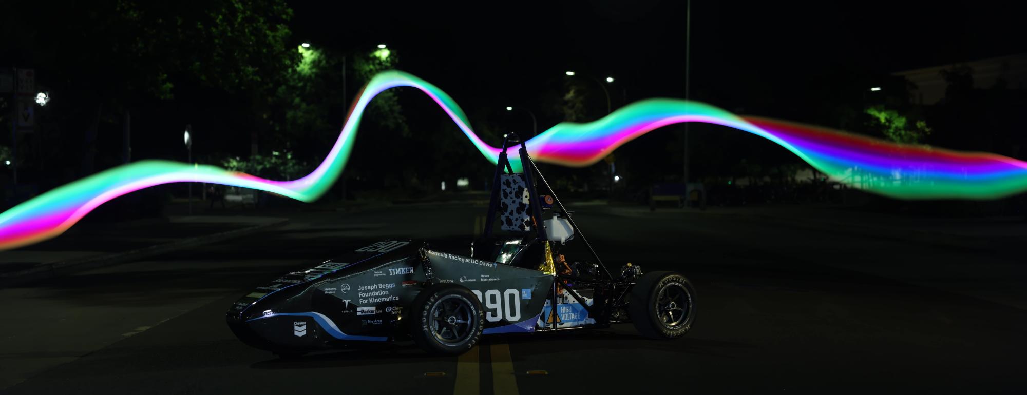 FE11 on street, with light streaks behind it