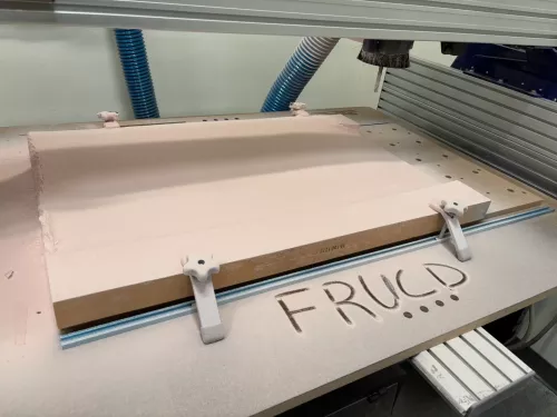 Photo of Panel Mold with text, "FRUCD"