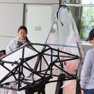 Picture of students standing around chassis